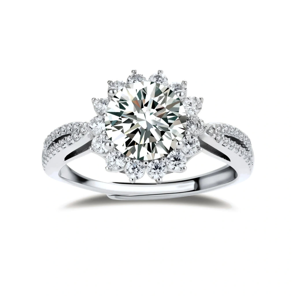 Close-up of sterling silver halo ring with brilliant round moissanite center stone surrounded by smaller accent stones