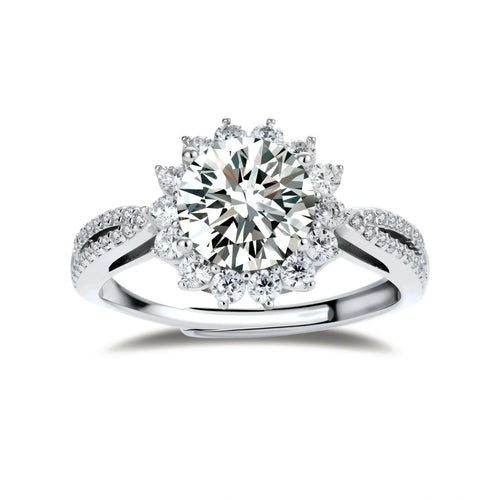 Close-up of sterling silver halo ring with brilliant round moissanite center stone surrounded by smaller accent stones