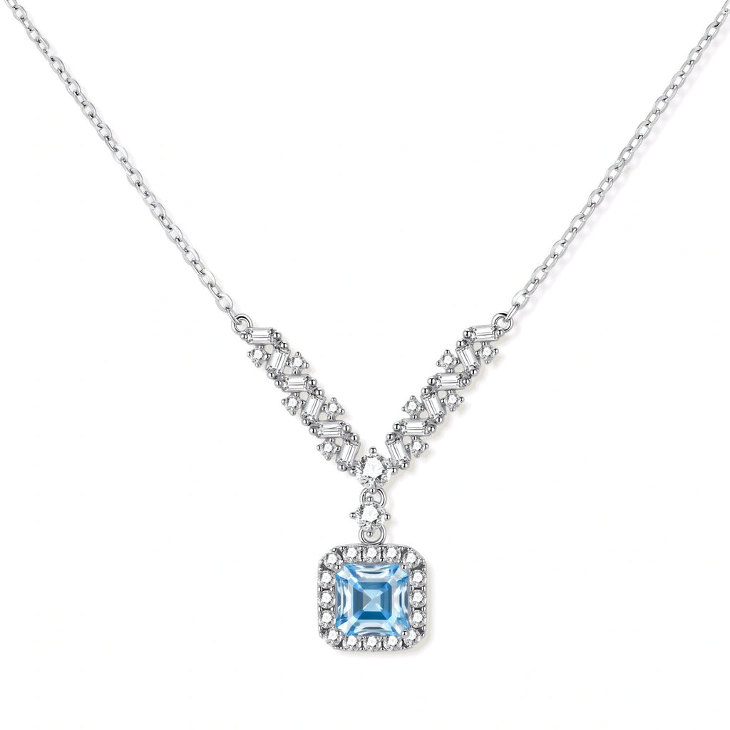Sterling silver necklace with geometric crystal arrangement forming a V-shape and square blue moissanite centerpiece pendant