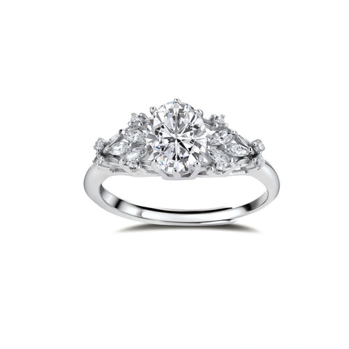 Sterling silver ring with oval moissanite center stone surrounded by smaller accent stones in ornate setting