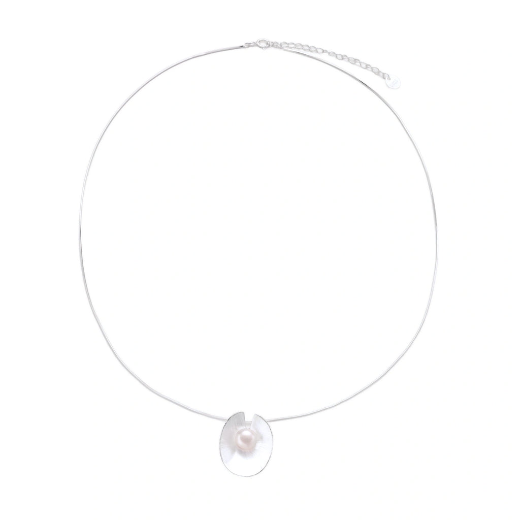 Sterling silver disc necklace with textured finish and centered freshwater pearl on delicate chain