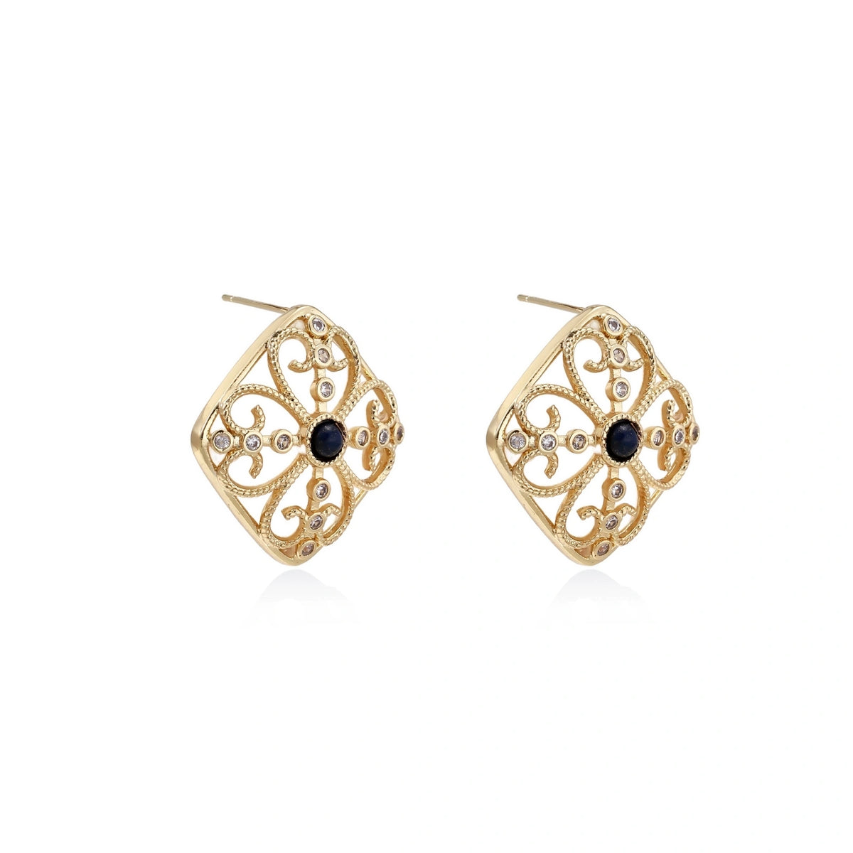 Gold filigree stud earrings with navy lapis lazuli center stone and mother-of-pearl accents in ornate quatrefoil design