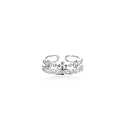 Silver-toned adjustable crown ring with channel-set square zirconia stones and delicate floral details on white background