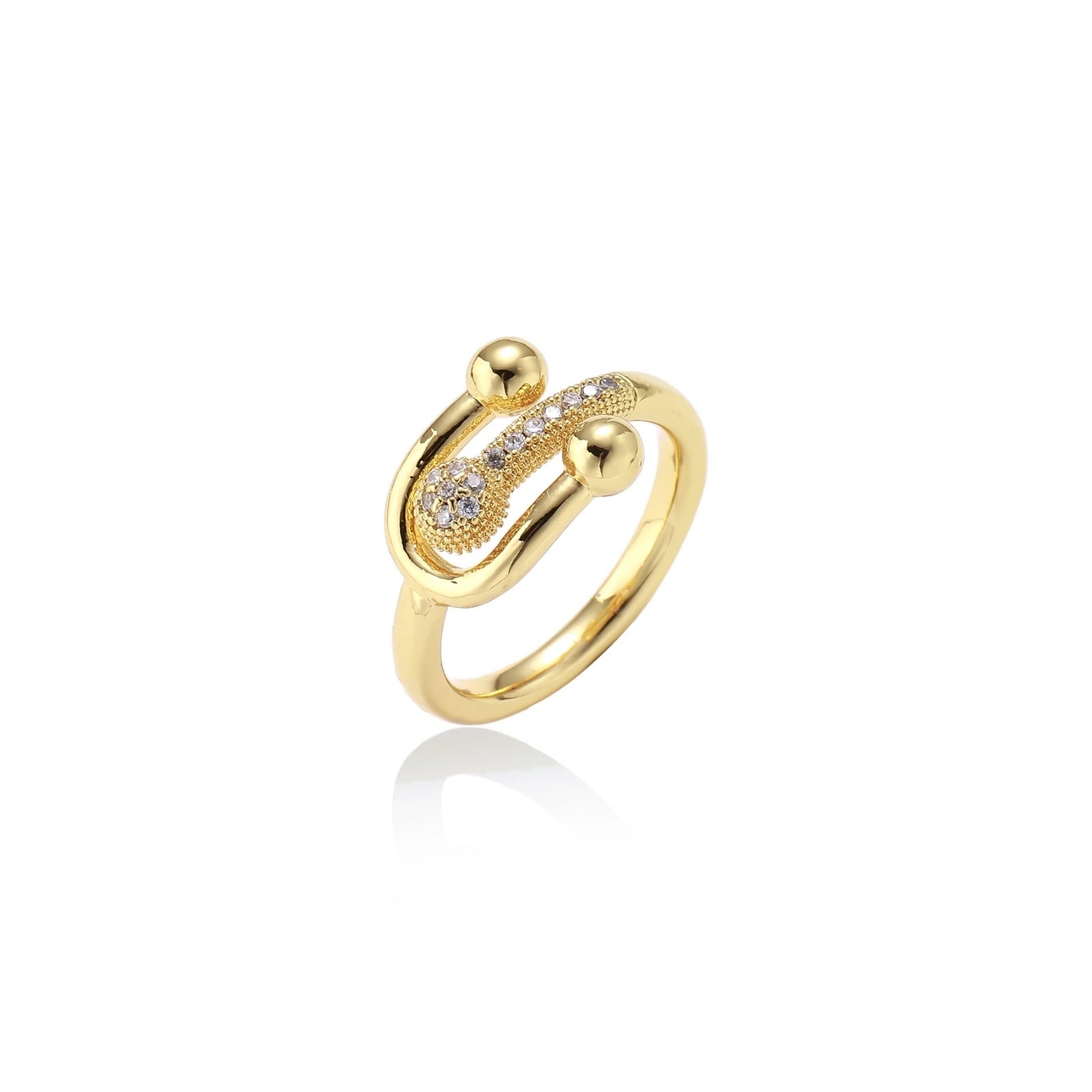 Gold-plated brass ring with safety pin design featuring pavé cubic zirconia stones and dual sphere ends