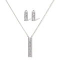 White gold plated necklace with vertical cubic zirconia pendant and matching hoop earrings on neutral background